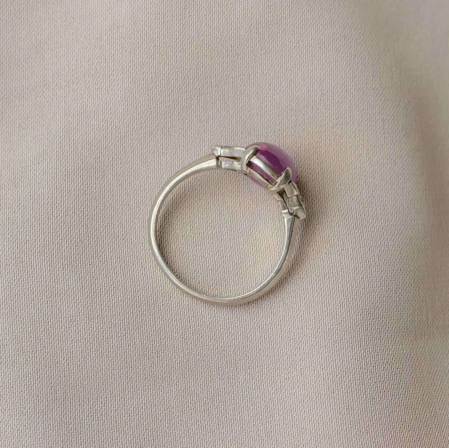 Cabochon Oval Pink Sapphire Platinum Ring with Trillion Cut Diamonds