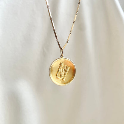 Vintage 18k Yellow Gold Aquarius the Waterbearer Repousse Medallion Pendant