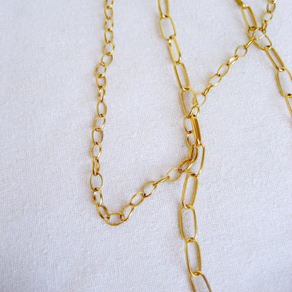This 18k small oval cable is shown with the larger oval cable chain variation draped together.